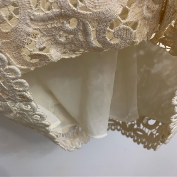 Ivory lace dress by Michael Kors is in like new condition. Size 2 - Picture 13 of 16